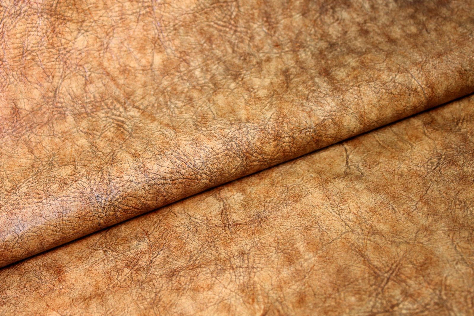 Vintage distressed leather on european cow hides hand worked